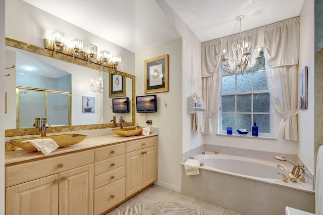 bathroom with shower with separate bathtub, a notable chandelier, tile patterned floors, and vanity