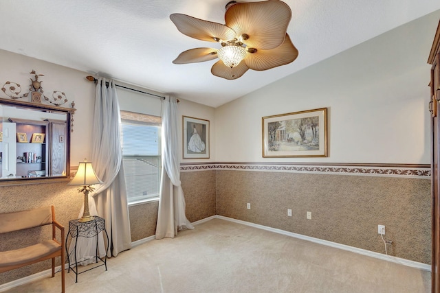 sitting room featuring vaulted ceiling, light carpet, and ceiling fan