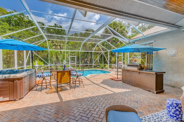 view of pool featuring a hot tub, glass enclosure, grilling area, and a patio