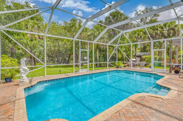 view of pool featuring a patio area and a lanai