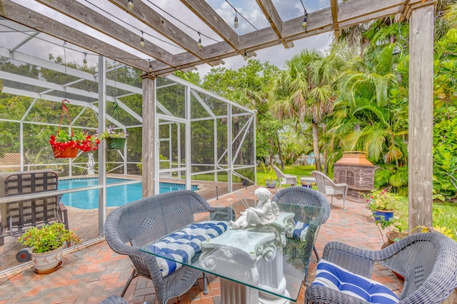 view of patio featuring a lanai