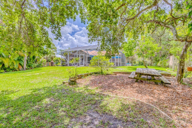 view of yard with a lanai