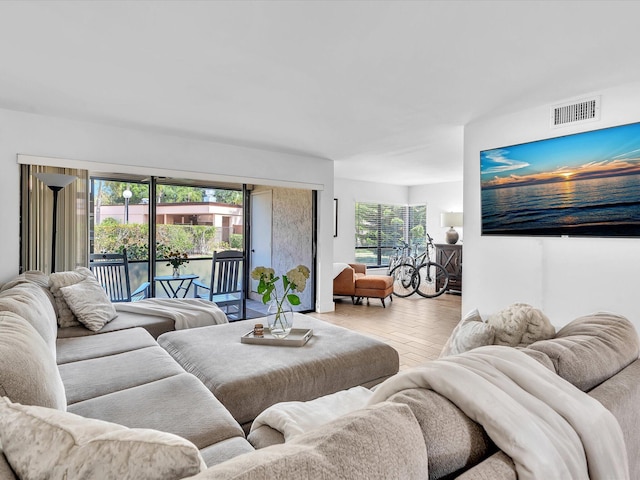 living room featuring light hardwood / wood-style flooring and plenty of natural light