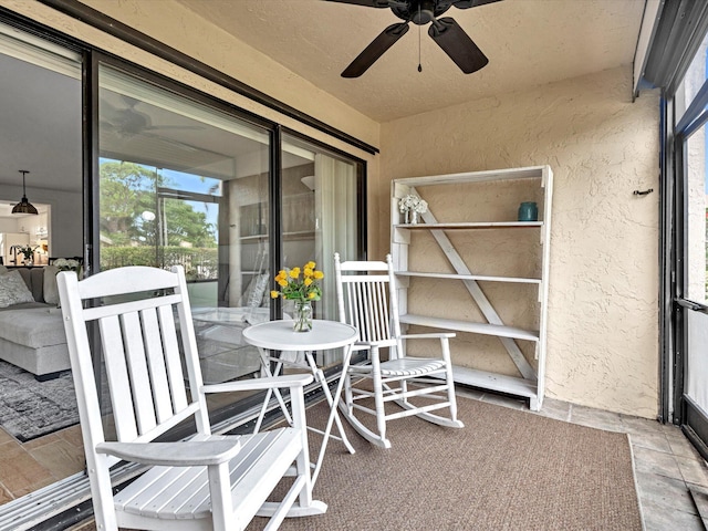 exterior space with ceiling fan