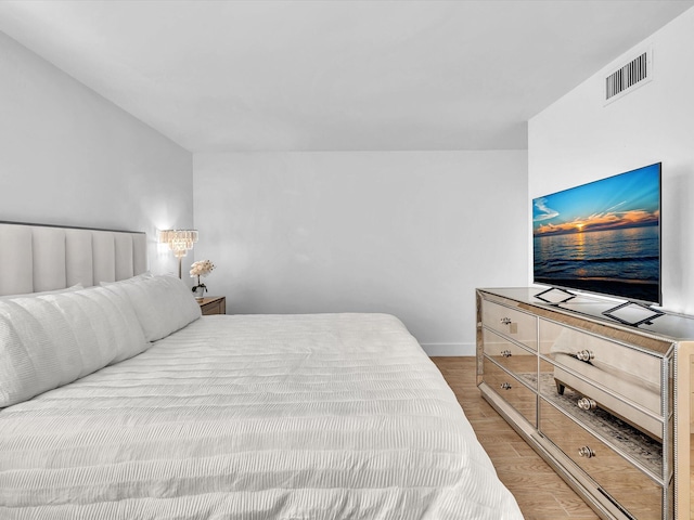 bedroom with wood-type flooring