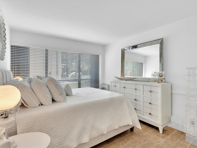 bedroom featuring light wood-type flooring