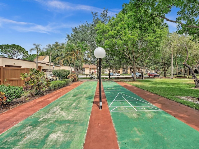 view of property's community featuring a lawn