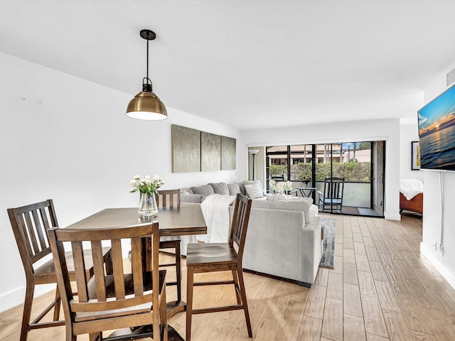 dining room featuring light hardwood / wood-style floors