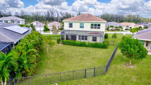 rear view of house with a yard