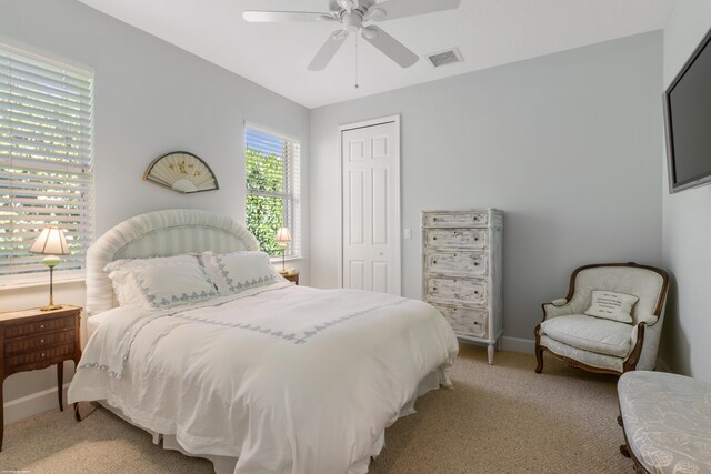 carpeted bedroom featuring a wall mounted air conditioner, crown molding, and a chandelier