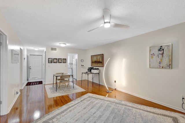 interior space featuring ceiling fan and wood-type flooring