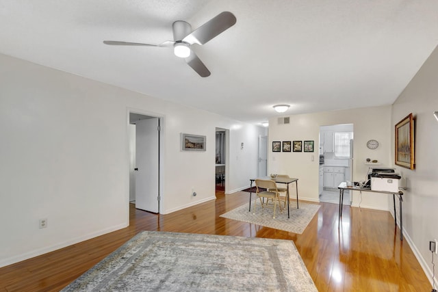 interior space featuring ceiling fan and hardwood / wood-style flooring