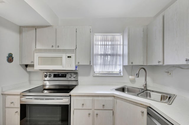 kitchen with sink, dishwasher, and stainless steel electric range