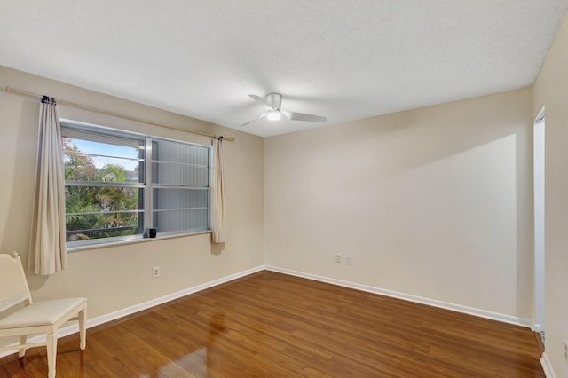 spare room featuring ceiling fan and hardwood / wood-style floors