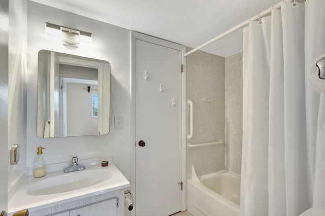 bathroom featuring vanity and shower / bath combo with shower curtain