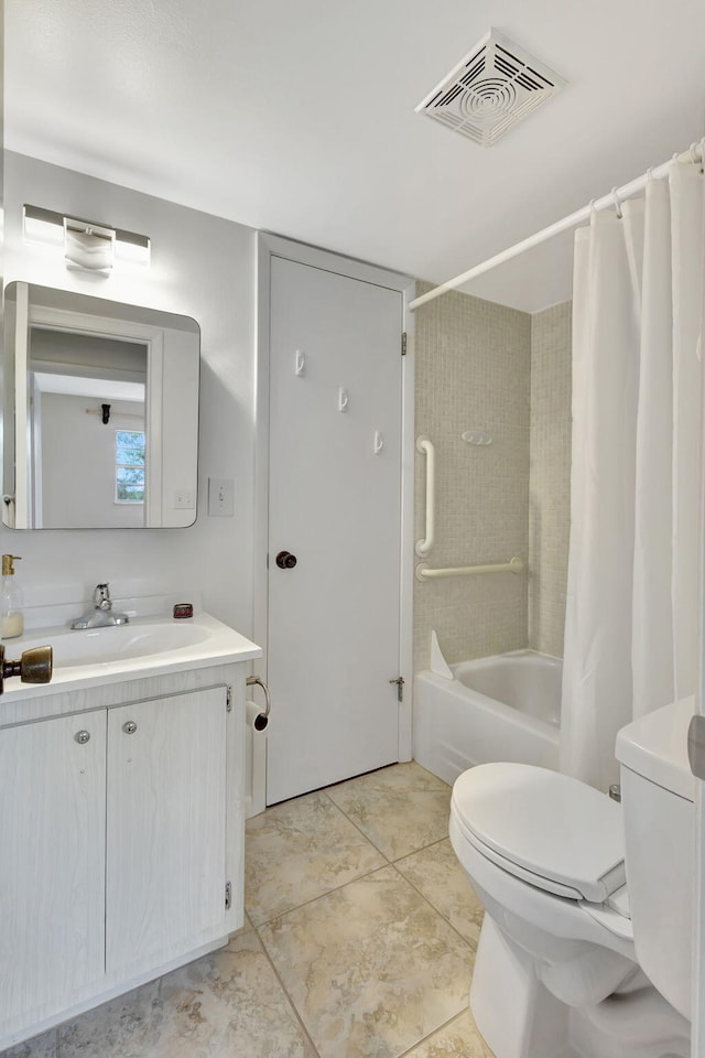 full bathroom with tile patterned floors, toilet, vanity, and shower / tub combo with curtain