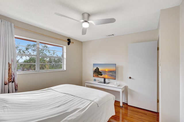 bedroom featuring ceiling fan and wood-type flooring