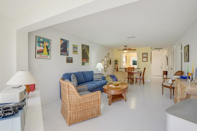 13735 Flora Pl Unit C, Delray Beach, FL 33484 - living room with ceiling fan, light tile patterned floors, and baseboards