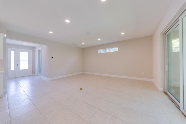 spare room featuring light tile patterned floors