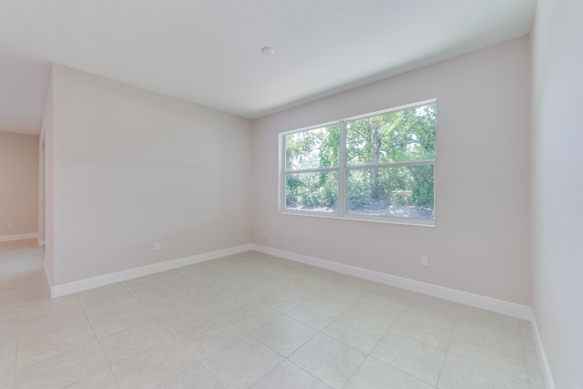 spare room with light tile patterned floors