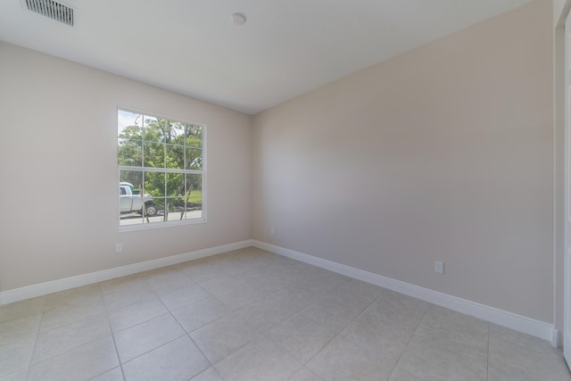 spare room with light tile patterned floors