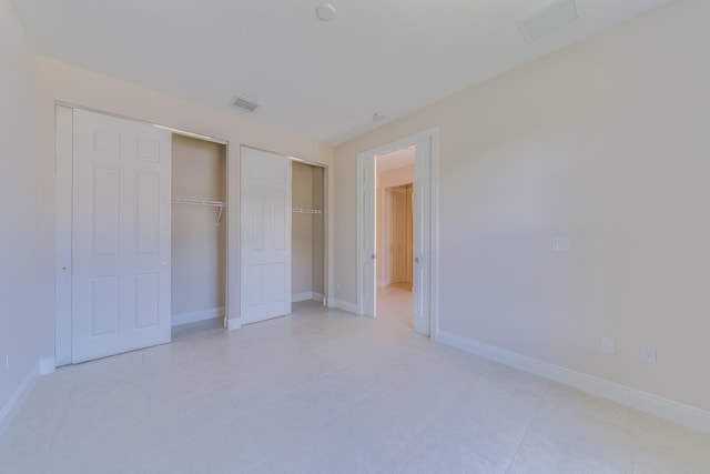 unfurnished bedroom featuring light tile patterned flooring