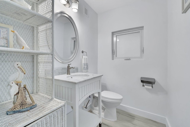 3140 NW 15th St, Delray Beach, FL 33445 - bathroom with vanity and wood finished floors