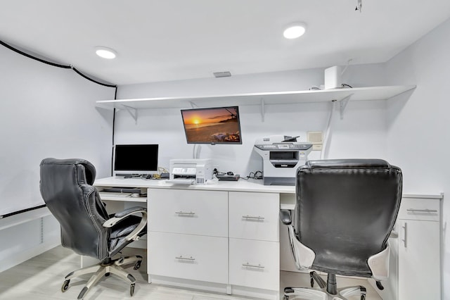 office space with light hardwood / wood-style floors