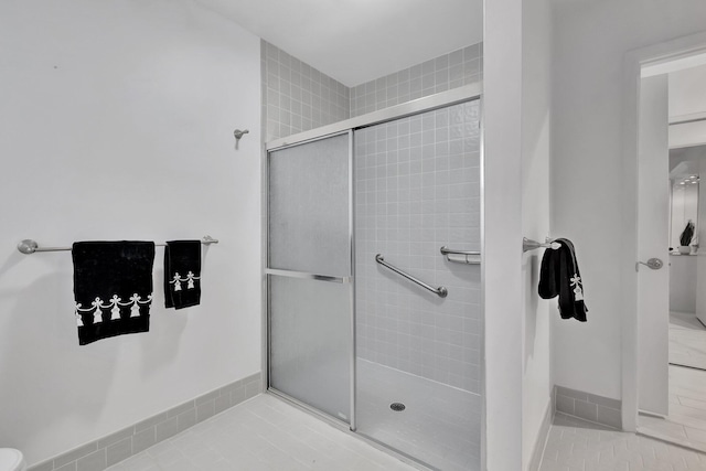 bathroom featuring tile patterned floors and walk in shower