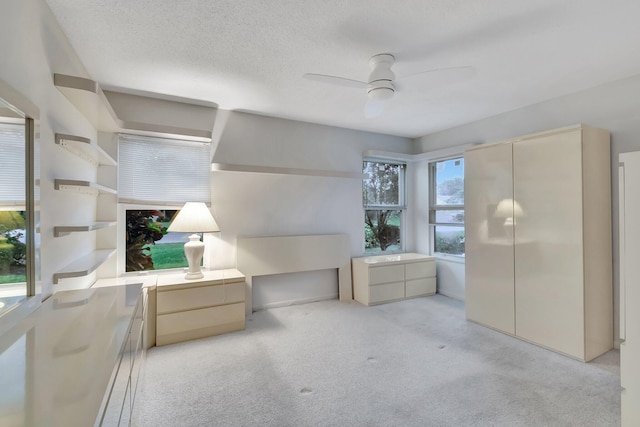 3140 NW 15th St, Delray Beach, FL 33445 - unfurnished room with light carpet, ceiling fan, and a textured ceiling
