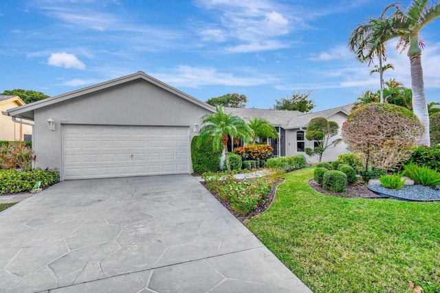 ranch-style home with a front yard and a garage