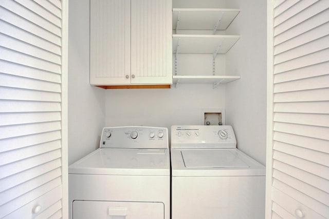 1701 Sabal Ridge Cir Unit G, Palm Beach Gardens, FL 33418 - laundry room with washer and dryer and cabinet space