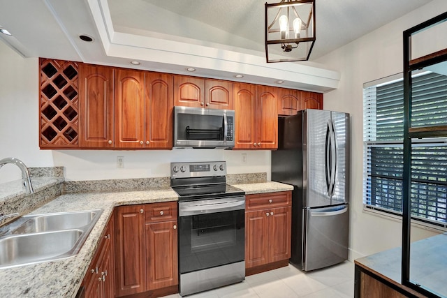 kitchen featuring a notable chandelier, plenty of natural light, sink, and stainless steel appliances