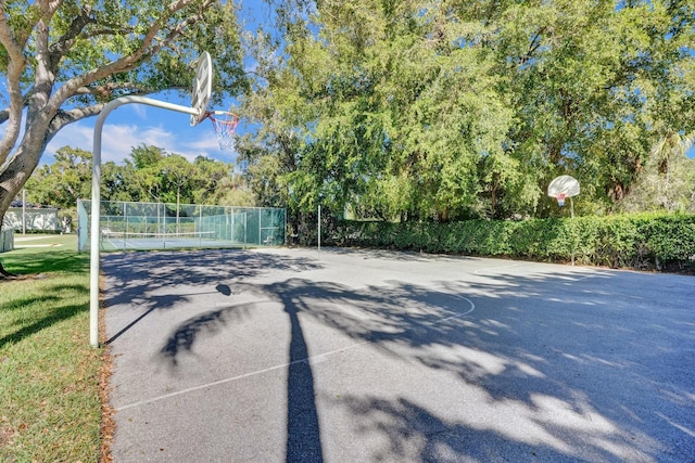 view of basketball court featuring tennis court