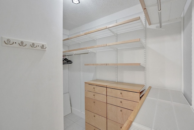 1701 Sabal Ridge Cir Unit G, Palm Beach Gardens, FL 33418 - spacious closet with light tile patterned floors