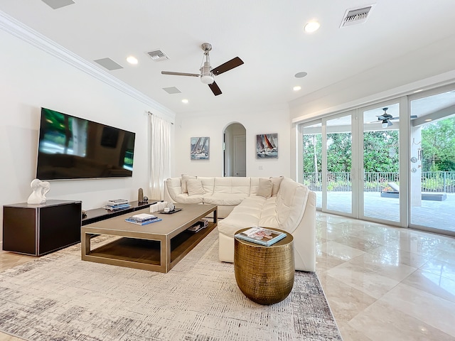 living room with ceiling fan and crown molding