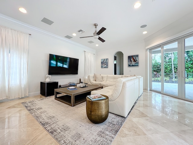 living room featuring ceiling fan and ornamental molding