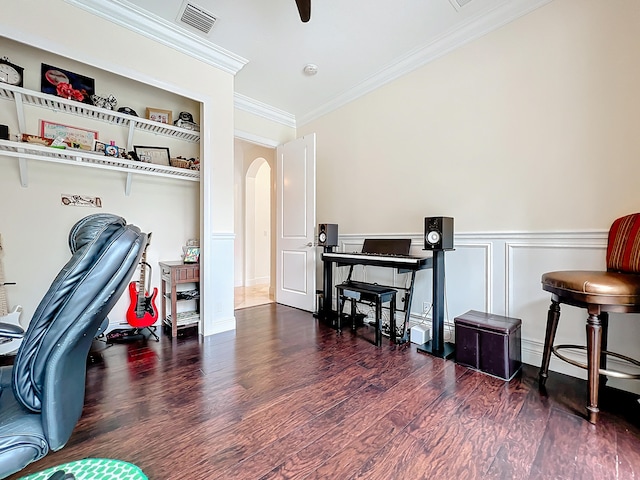 home office with dark wood-type flooring and crown molding