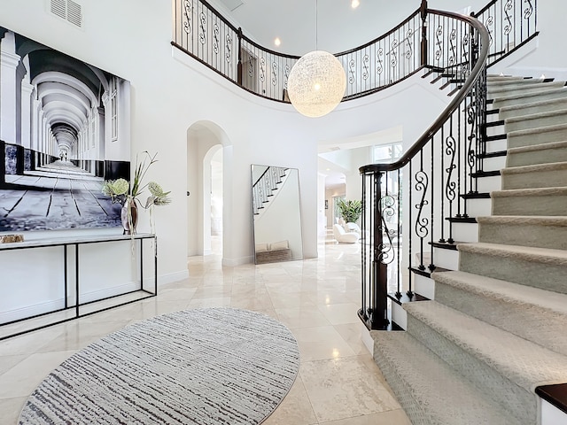 foyer with a towering ceiling