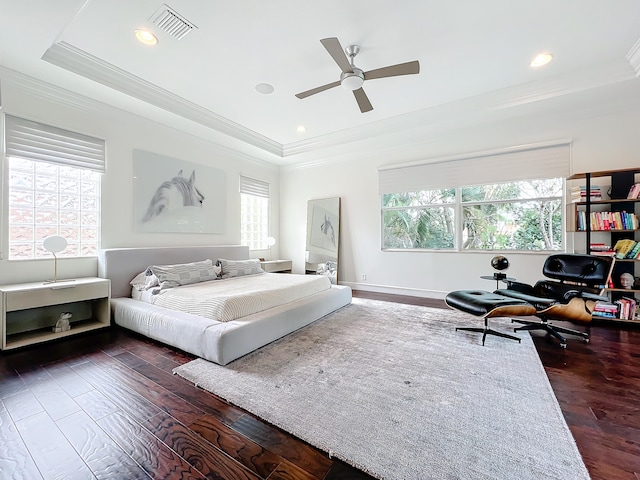 bedroom with dark wood-type flooring, ceiling fan, and crown molding