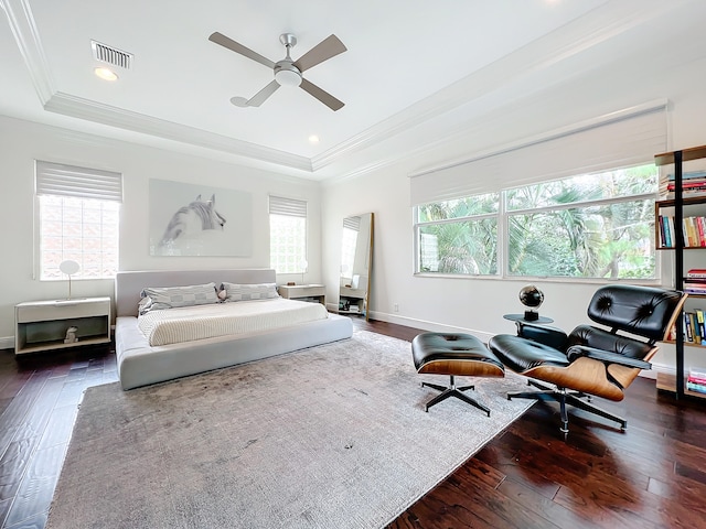 bedroom featuring multiple windows, dark hardwood / wood-style flooring, and ceiling fan