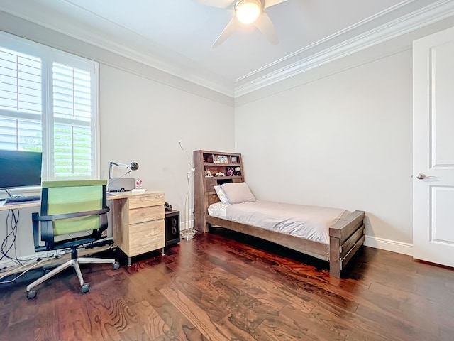 bedroom featuring dark hardwood / wood-style flooring, ceiling fan, and crown molding