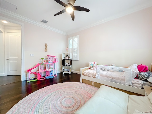 bedroom featuring dark hardwood / wood-style flooring, ceiling fan, and crown molding