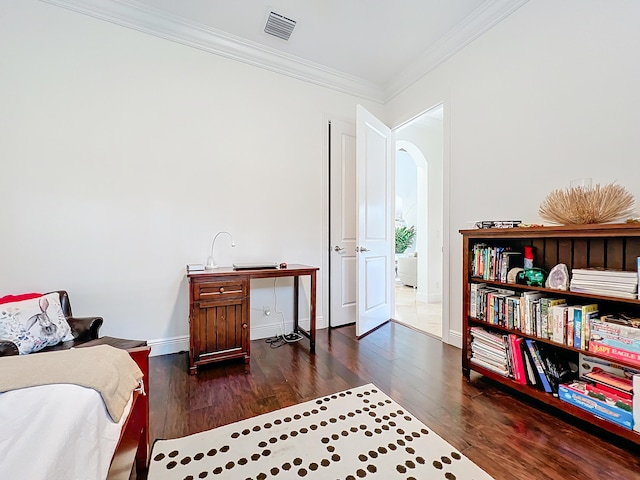 sitting room featuring dark hardwood / wood-style flooring and crown molding