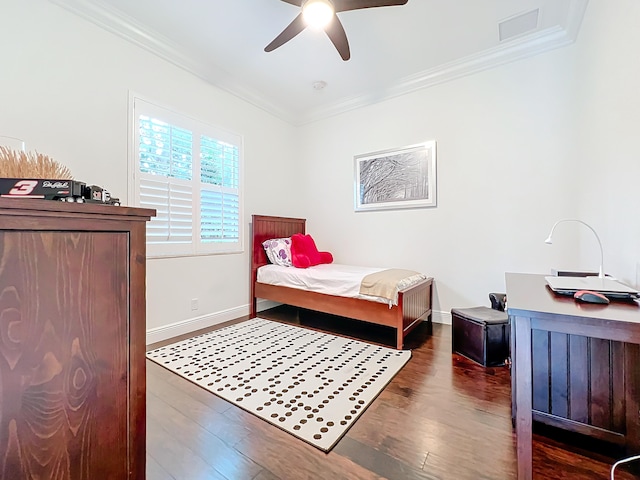 bedroom featuring ceiling fan, dark hardwood / wood-style flooring, and ornamental molding