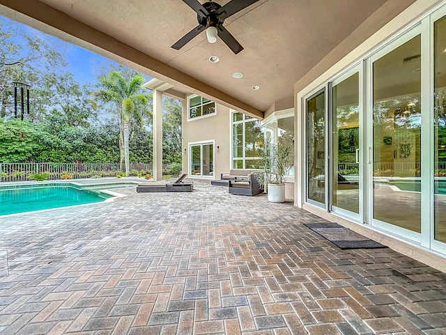 view of pool featuring a patio and ceiling fan