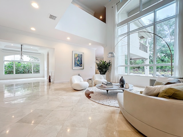 living room with a towering ceiling