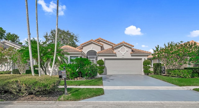 mediterranean / spanish-style home featuring a garage