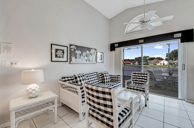 tiled dining space featuring high vaulted ceiling and ceiling fan