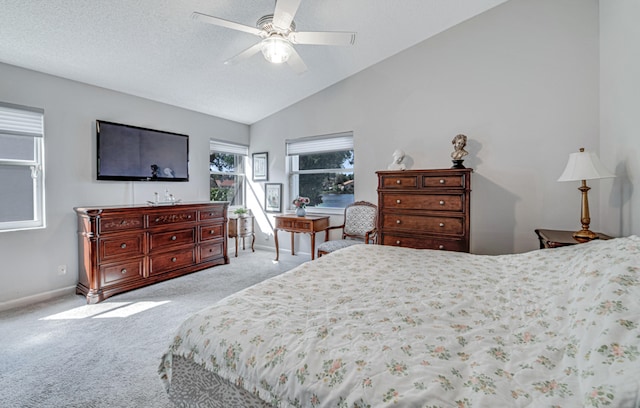 bedroom featuring a textured ceiling, ceiling fan, light colored carpet, and lofted ceiling